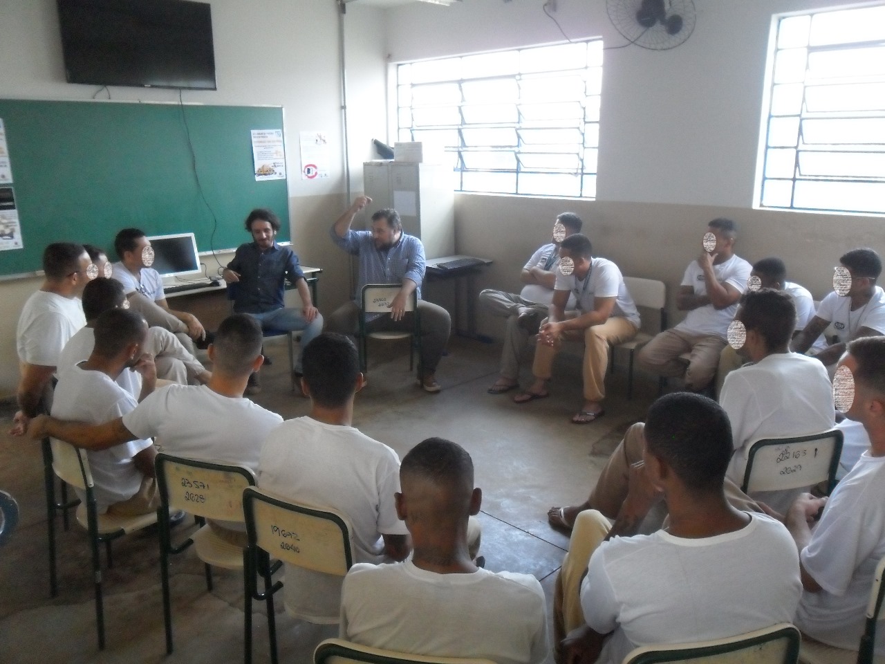 Group activity led by Casarotto in a prison; participants’ faces are obscured in the official source image
